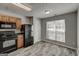 Efficient kitchen with black appliances, wood cabinets and gray vinyl floors at 3911 Waldrop Ln, Decatur, GA 30034