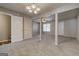 Open living room featuring neutral carpet, gray walls, and architectural pillars at 3911 Waldrop Ln, Decatur, GA 30034