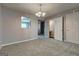 Cozy living space features neutral paint, wall cut-out, carpet floors, and updated lighting at 3911 Waldrop Ln, Decatur, GA 30034