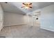 Open living space with neutral walls, ceiling fan, and carpet, perfect for relaxing and entertaining at 3911 Waldrop Ln, Decatur, GA 30034