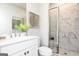 Elegant bathroom with a glass-enclosed shower, marble-like tile, and a modern vanity at 337 Skylar Se Way, Atlanta, GA 30315