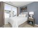Comfortable bedroom featuring a large window, stylish decor, and a calming color scheme at 337 Skylar Se Way, Atlanta, GA 30315