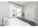 Bright bedroom featuring large windows, a stylish bed, and ample closet space at 337 Skylar Se Way, Atlanta, GA 30315
