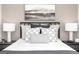 Comfortable bedroom featuring a neatly made bed with stylish pillows and complementary nightstands at 337 Skylar Se Way, Atlanta, GA 30315