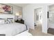 Serene bedroom showcasing a plush bed, modern decor, and access to an ensuite bathroom at 337 Skylar Se Way, Atlanta, GA 30315