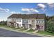 New construction townhomes with manicured lawns and craftsman style elevations at 337 Skylar Se Way, Atlanta, GA 30315