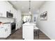 Contemporary kitchen with white cabinetry, stainless appliances and a large island with pendant lights at 337 Skylar Se Way, Atlanta, GA 30315