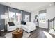 Bright living area with hardwood flooring, a sectional sofa, and an abundance of natural light at 337 Skylar Se Way, Atlanta, GA 30315