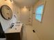 Updated bathroom with stylish vanity, tile floors, and a tub-shower combination at 1 Maple St, Porterdale, GA 30014