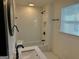The bathroom has sleek white subway tiles, black fixtures, and a convenient shower niche at 1 Maple St, Porterdale, GA 30014