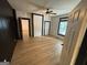 Spacious bedroom featuring wood-look flooring, neutral paint, and a ceiling fan at 1 Maple St, Porterdale, GA 30014