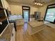 Updated kitchen featuring granite countertops, stainless steel appliances, a kitchen island and lots of cabinets at 1 Maple St, Porterdale, GA 30014
