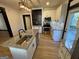 This kitchen features granite countertops, stainless appliances, a center island with sink and sleek backsplash at 1 Maple St, Porterdale, GA 30014