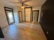 Bright room with wood look flooring, a ceiling fan and natural light entering through the window at 1 Maple St, Porterdale, GA 30014