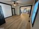 Open concept living area featuring luxury wood look flooring and black trim on windows and doors at 1 Maple St, Porterdale, GA 30014