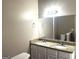 Well-lit bathroom featuring double sink vanity with granite countertop, and modern fixtures at 1273 Baywood Gln, Lithonia, GA 30058