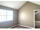 Cozy bedroom with neutral walls, carpet, large window with blinds, and plenty of natural light at 1273 Baywood Gln, Lithonia, GA 30058