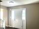 View of entryway with white door, sidelights and dark flooring at 1273 Baywood Gln, Lithonia, GA 30058
