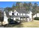 Traditional two-story home featuring a well-manicured lawn and beautiful landscaping at 1273 Baywood Gln, Lithonia, GA 30058