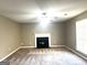 Living room featuring fireplace and bright window at 1273 Baywood Gln, Lithonia, GA 30058
