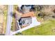 An aerial view of the home showing the landscaped yard, driveway, and the home's roof with solar panels at 721 Wedowee St, Bowdon, GA 30108