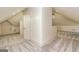 Finished attic space featuring carpet, recessed lighting, dormers, and neutral paint at 721 Wedowee St, Bowdon, GA 30108