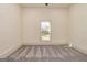 Neutral bedroom with window and carpet floors at 721 Wedowee St, Bowdon, GA 30108