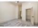 Bedroom featuring a closet and entry to another room with neutral paint at 721 Wedowee St, Bowdon, GA 30108