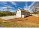 Home exterior displays a well-kept lawn and a new gravel driveway, ready for outdoor enjoyment at 721 Wedowee St, Bowdon, GA 30108