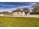 Charming home boasts a well-manicured lawn, new gravel driveway, and inviting white picket fence at 721 Wedowee St, Bowdon, GA 30108