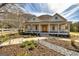 Charming home with a welcoming front porch, complemented by a beautifully landscaped yard and an elegant arched walkway at 721 Wedowee St, Bowdon, GA 30108