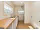 Convenient laundry room with wood countertop, sink, and natural light at 721 Wedowee St, Bowdon, GA 30108