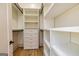Organized walk-in closet with custom shelving and drawers, providing ample storage space at 721 Wedowee St, Bowdon, GA 30108