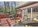 Cozy deck with patio furniture, a grill, and a charming potting bench with plants at 300 The Enclave, Peachtree City, GA 30269