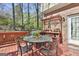Outdoor dining set and potting bench on the deck, perfect for outdoor entertaining at 300 The Enclave, Peachtree City, GA 30269