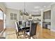 Stylish dining area featuring hardwood floors and easy access to the kitchen at 300 The Enclave, Peachtree City, GA 30269
