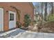 Private backyard with a stone pathway leading through lush landscaping at 300 The Enclave, Peachtree City, GA 30269