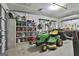 Well-organized garage featuring tools and lawn care equipment, perfect for hobbyists at 300 The Enclave, Peachtree City, GA 30269