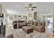 Open-concept living room with hardwood floors, fireplace, and staircase access at 300 The Enclave, Peachtree City, GA 30269