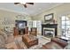 Comfortable living room with fireplace, hardwood floors, and ample seating area at 300 The Enclave, Peachtree City, GA 30269