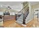 Carpeted staircase leading to the second floor, adjacent to the cozy living room at 300 The Enclave, Peachtree City, GA 30269