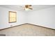 Bedroom with neutral carpeting, ceiling fan, and window providing natural light at 40 Derby Country Dr, Ellenwood, GA 30294