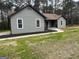 Charming single-story home with fresh landscaping and a welcoming covered front porch at 127 Brookwood Estates Trl, Stockbridge, GA 30281