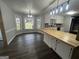 Open floor plan with dining area and a kitchen island with butcher block countertop at 127 Brookwood Estates Trl, Stockbridge, GA 30281