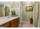 Well-maintained bathroom featuring a vanity, decorative mirror, and shower with a curtain at 152 Summerfield Dr, Mcdonough, GA 30253