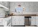Functional kitchen with white cabinets, stainless steel appliances, and a window with a view at 152 Summerfield Dr, Mcdonough, GA 30253