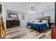 Serene main bedroom with a ceiling fan, wood-look floors and ample closet space at 152 Summerfield Dr, Mcdonough, GA 30253