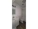 Well-lit bathroom featuring a vanity, toilet, and bathtub with white subway tile at 5796 Par Four Ct, Lithonia, GA 30038
