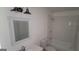Bathroom with subway tiled shower, vanity, mirror, and modern lighting at 5796 Par Four Ct, Lithonia, GA 30038