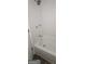 Bright bathroom featuring a tub with white tiled walls and chrome fixtures at 5796 Par Four Ct, Lithonia, GA 30038
